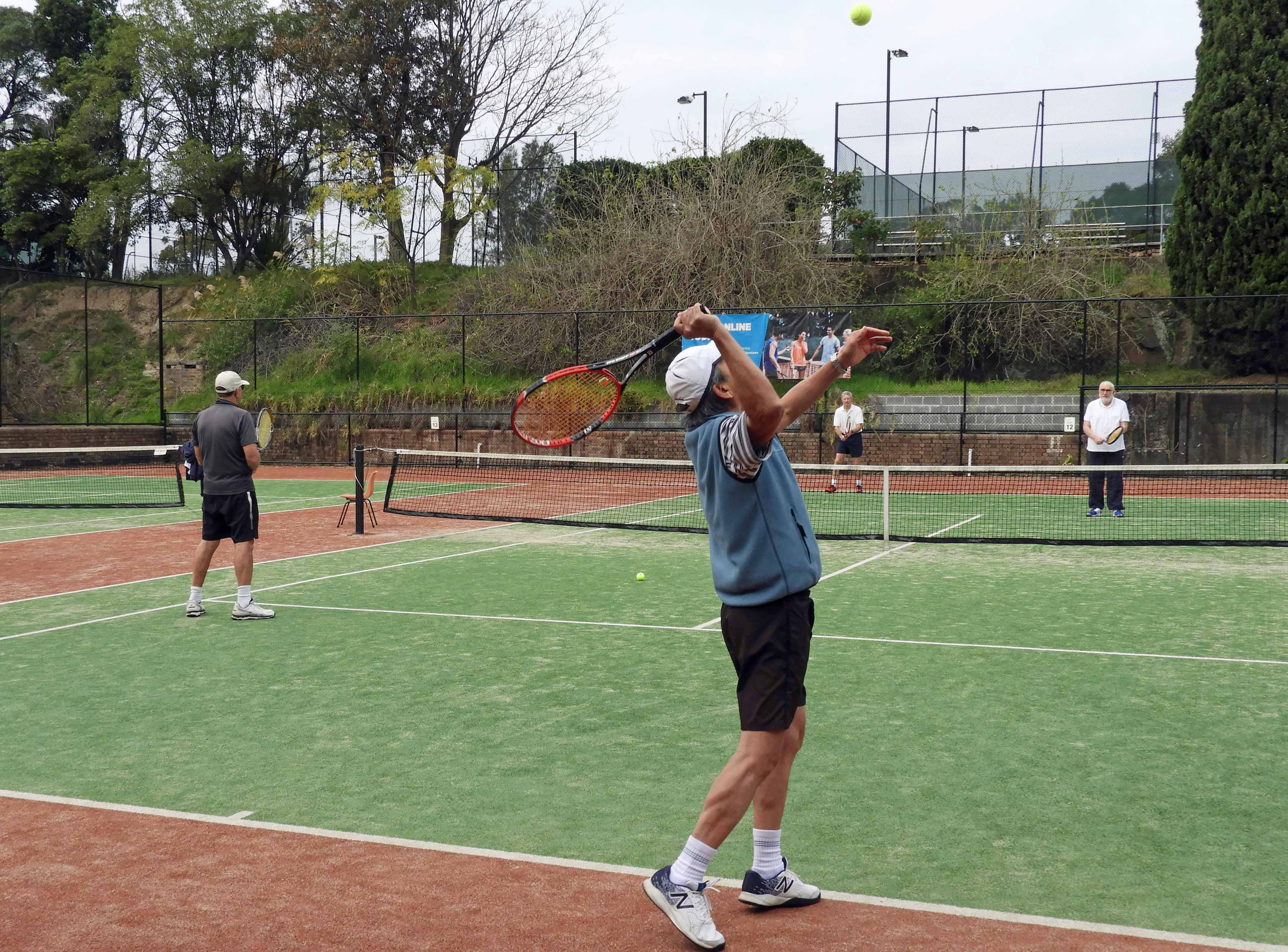 group playing tennis